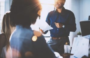 6 Tips For Managing Small Business Finances conducting a meeting