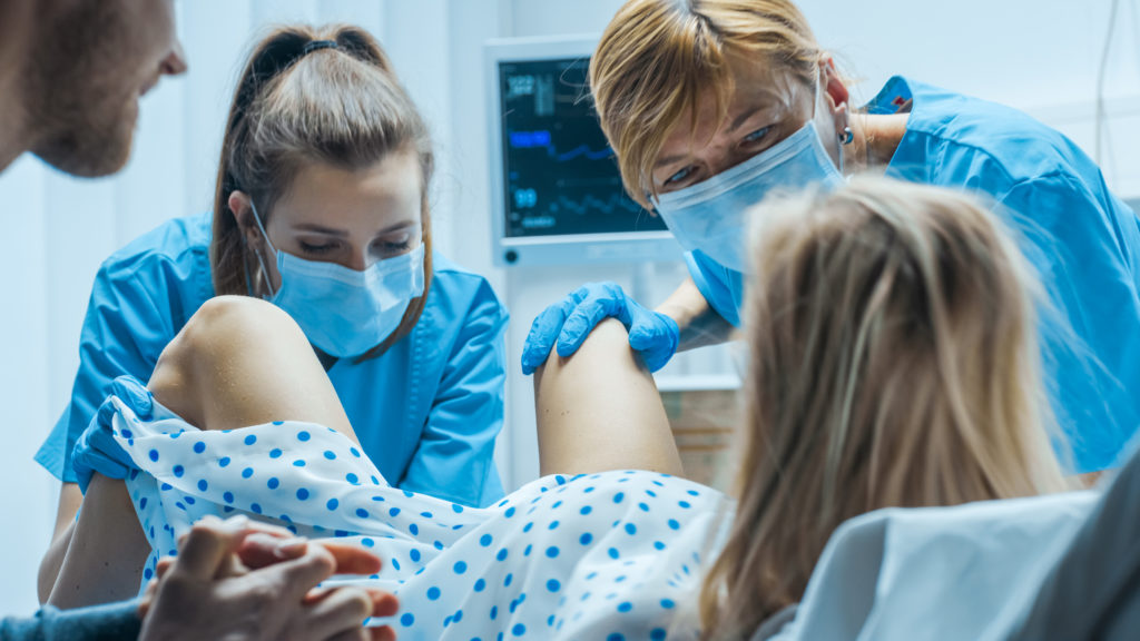 In the Hospital Woman in Labor Pushes to Give Birth