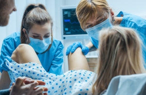 Types Of Birth Injuries To Keep An Eye Out For In the Hospital Woman in Labor Pushes to Give Birth