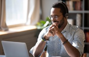 How To Recruit And Hire Remote Employees man on laptop