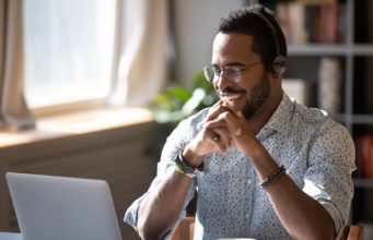 How To Recruit And Hire Remote Employees man on laptop