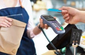 How to Pick the Perfect Debit Card for You customer making a purchase with a debit card