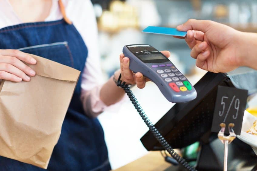 customer making a purchase with a debit card