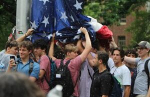 UNC Fraternity Members Protect Reinstated American Flag from Campus Group Swapping It with Palestinian Flag UNC Fraternity Members Protect Reinstated American Flag from Campus Group Swapping It with Palestinian Flag
